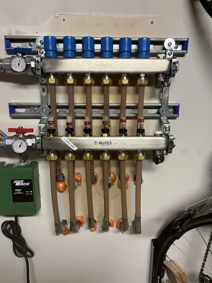 Plumber performing Water Heater Repair at a residential property in Norton